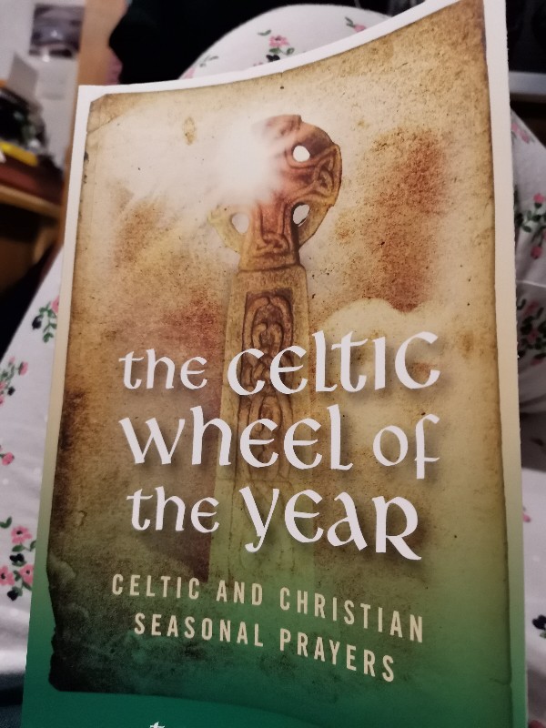The celtic wheel of the year book by Tess Ward, celtic Christianity, celtic prayer book, Irish celtic tradition and Christianity, pagan and Christianity union